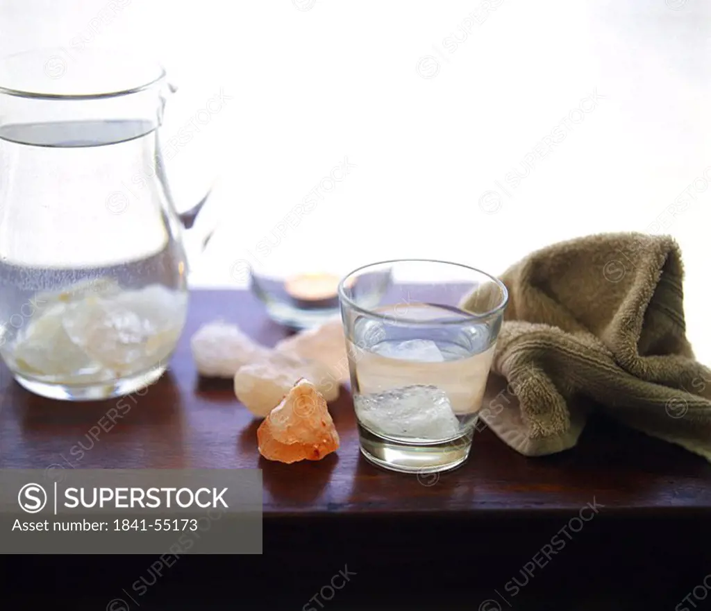 Gemstones and jar on table