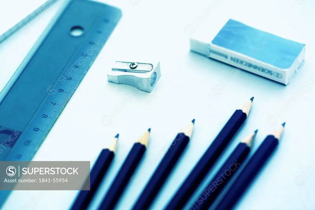 High angle view of pencil sharpener and pencils