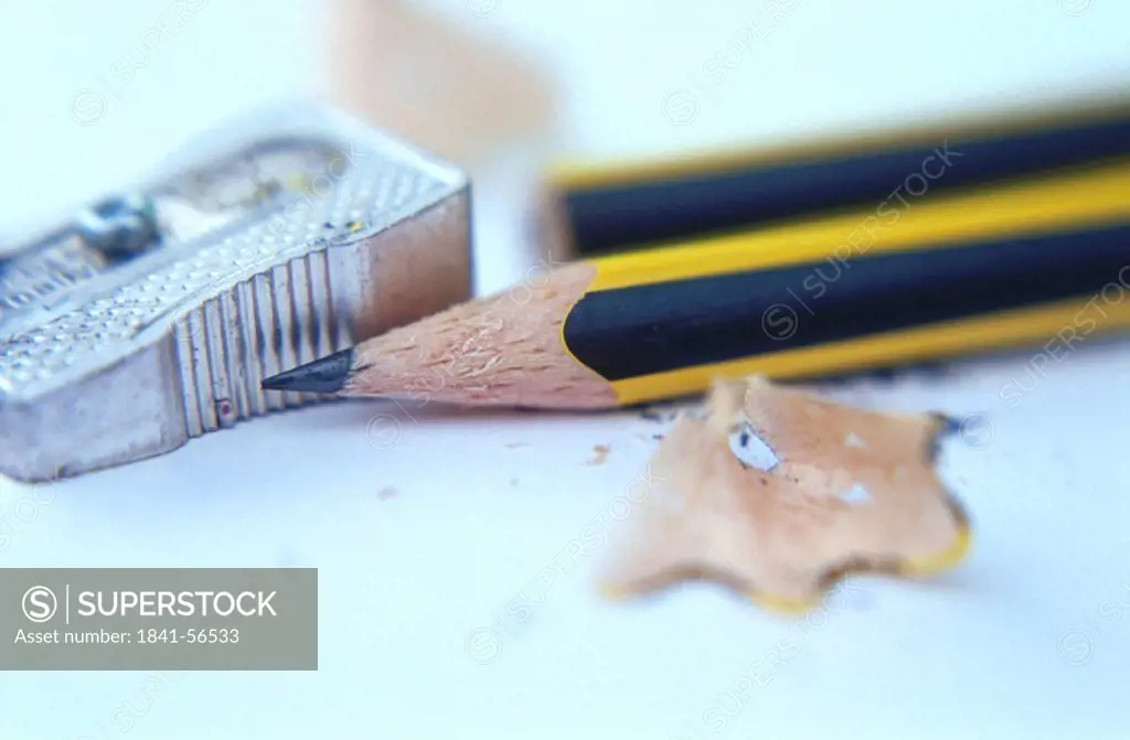 Close_up of pencils, pencil sharpener and shavings