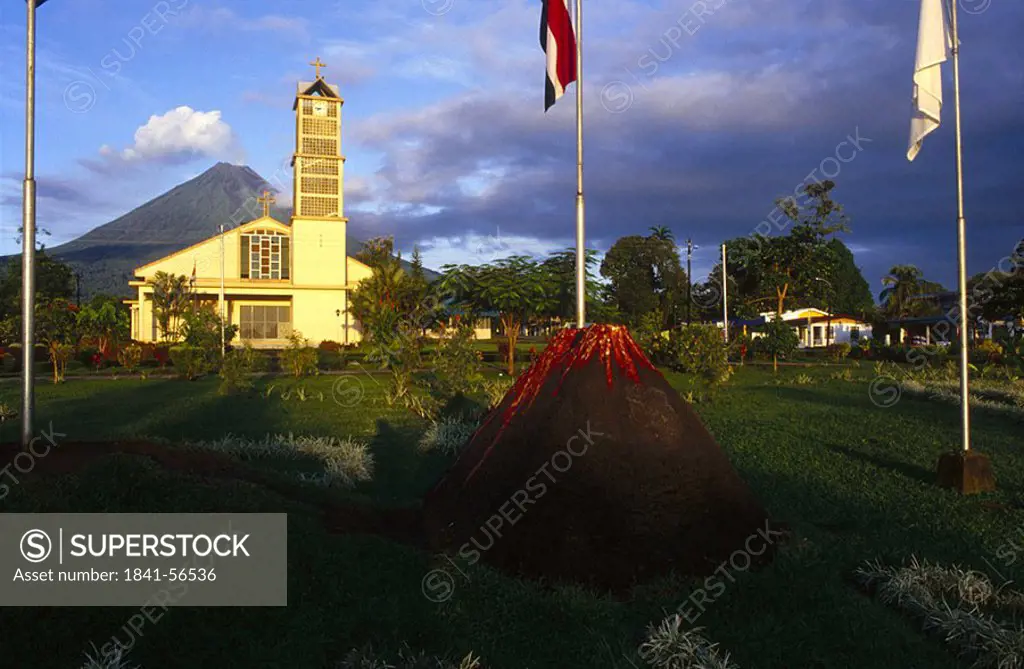 Flags in front of church at dusk, La Fortuna, Costa Rica