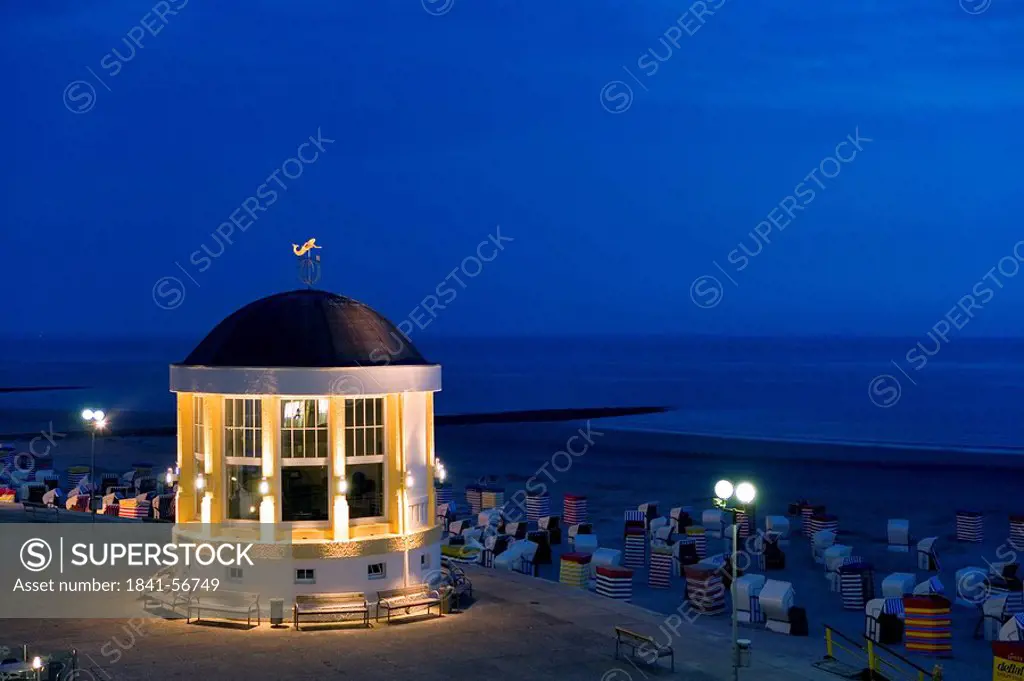 Pavilion and hooded beach chairs on beach at night, Borkum, Lower Saxony, Germany