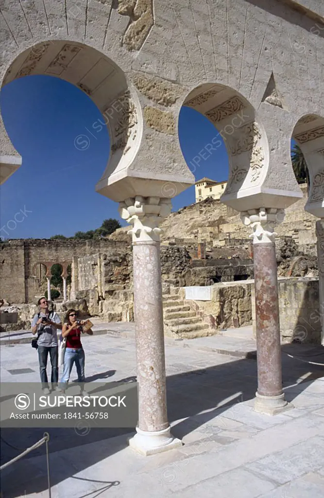 Tourists at ruins of mosque, Madinat al_Zahra, Cordoba, Andalusia, Spain