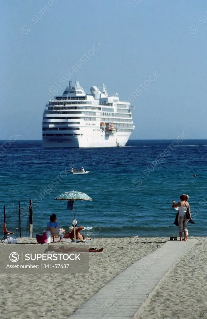 Cruise ship moored near beach, Giardini Naxos, Sicily, Italy