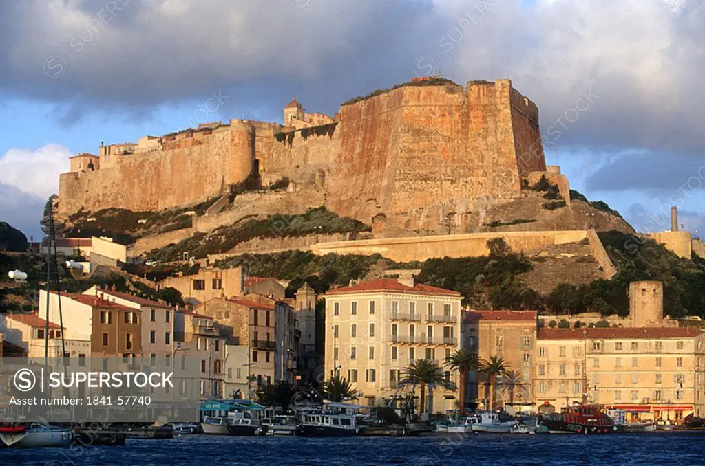 Castle on hill overlooking town, Corsica, France