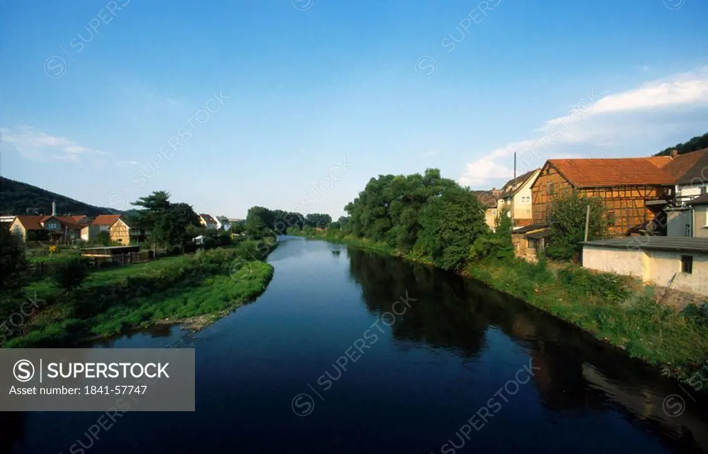 River flowing through town, Saale River, Thuringia, Germany