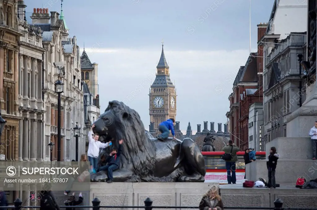 Lion statue with clock tower in background, Big Ben, Houses Of Parliament, City Of Westminster, London, England