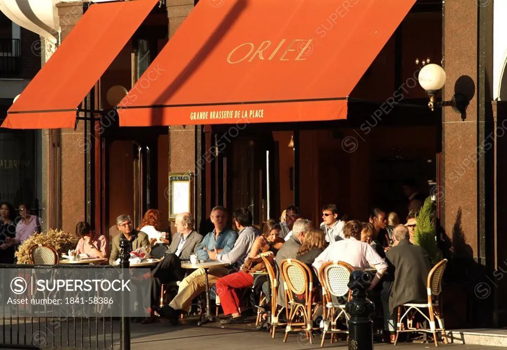 People at sidewalk cafe, London, England