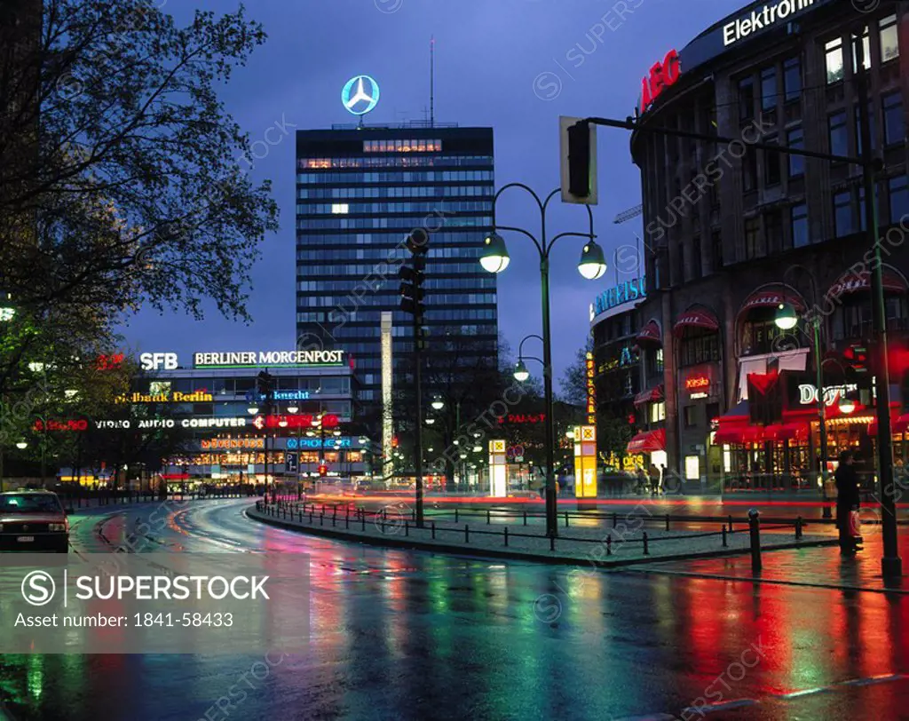 Buildings in city lit up at night, Berlin, Germany