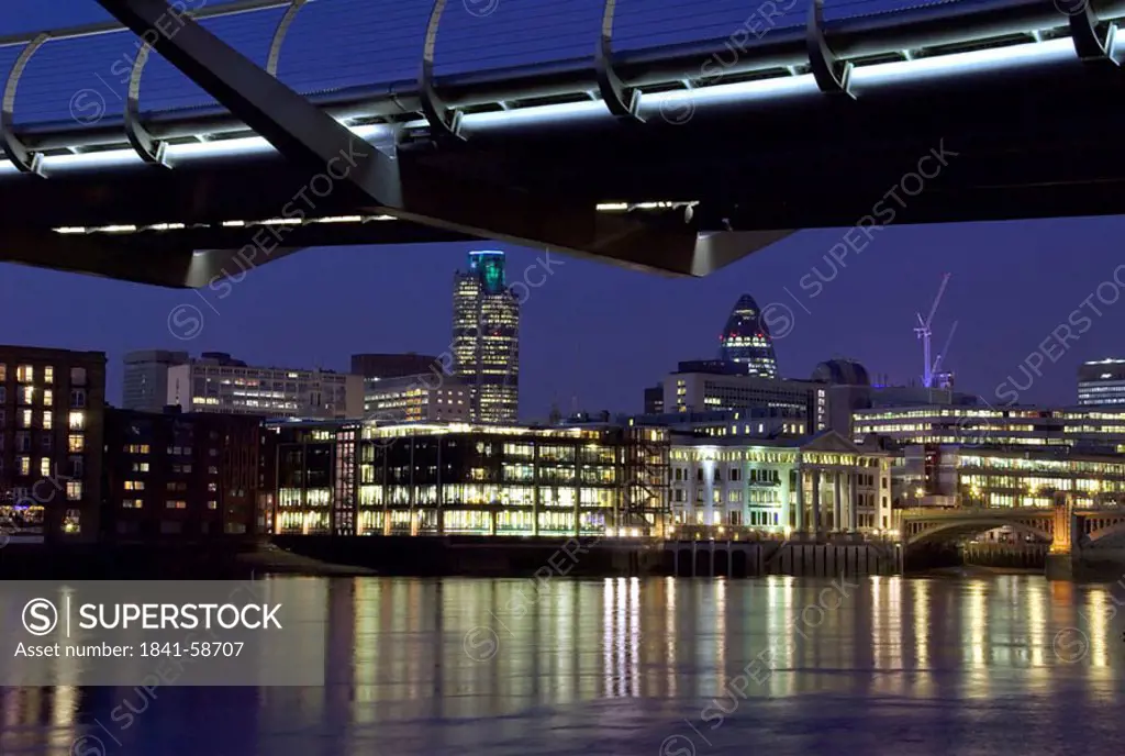 Bridge lit up at night, Millennium Bridge, Thames River, London, England
