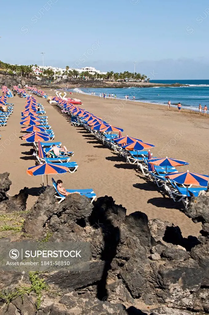Tourists on the beach, Puerto del Carmen, Lanzarote, Spain, elevated view