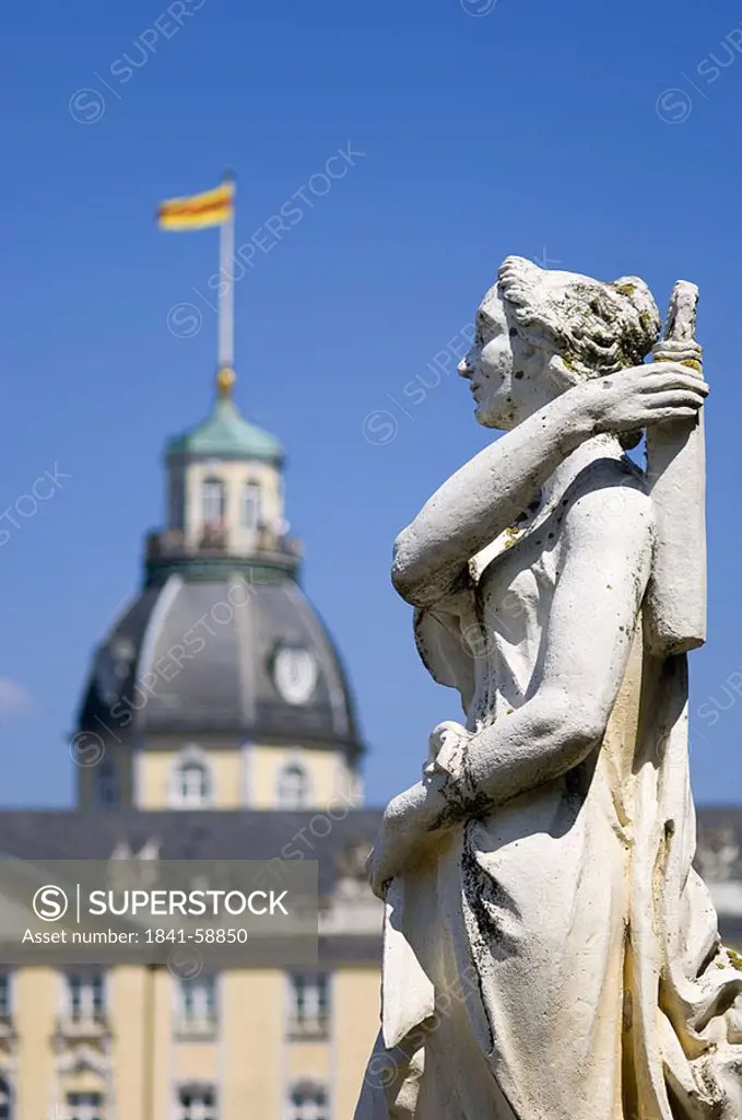 Statue in front of castle