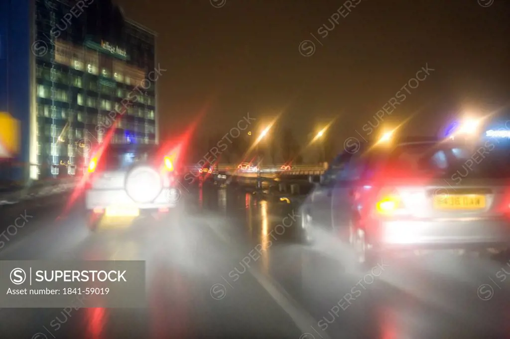 Traffic on road at night, London, England