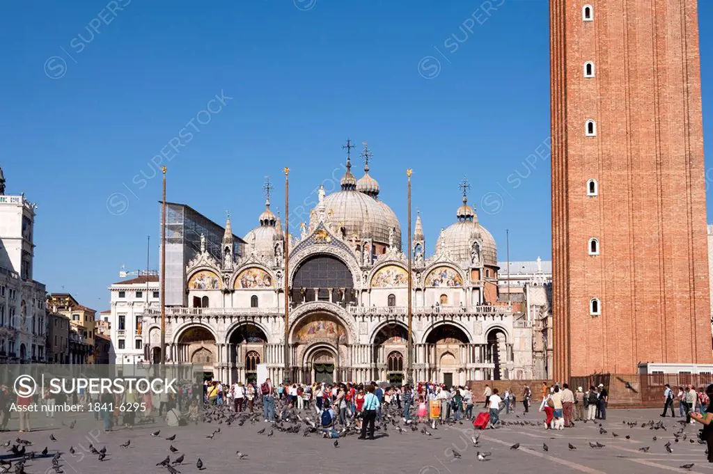 Tourists on St Marks Square in front of the Basilica of San Marco, Venice, Italy