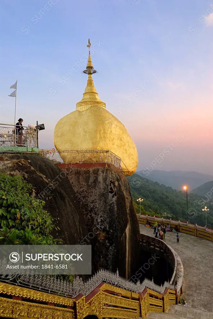 Low angle view of pagoda on golden rock, Kyaiktiyo Pagoda, Mon State, Myanmar