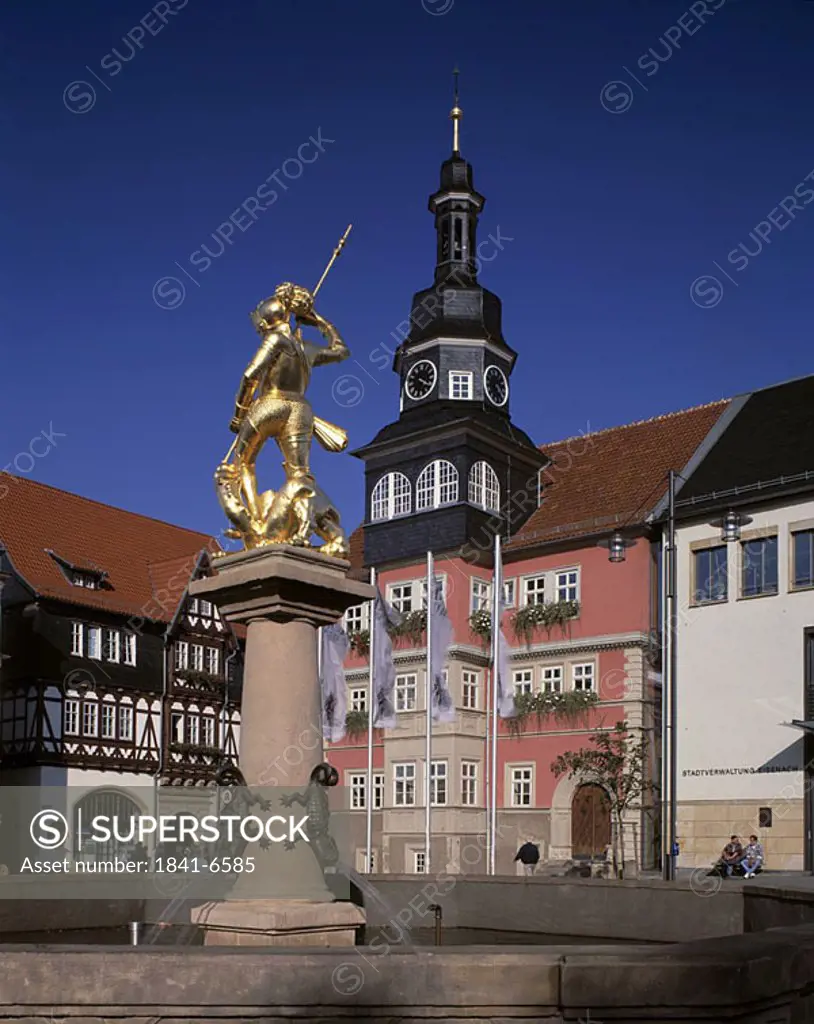 Georgsbrunnen fountain statue in front of city hall, St George Church, Eisenach, Thuringia, Germany