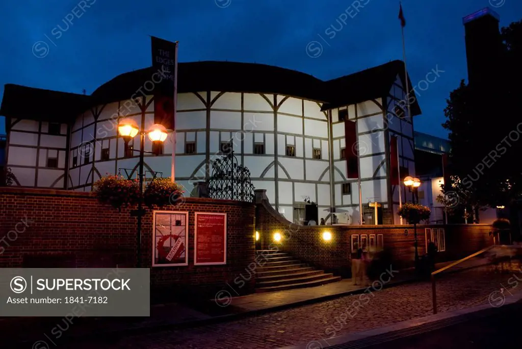 Theater lit up at night, Globe Theatre, London, England