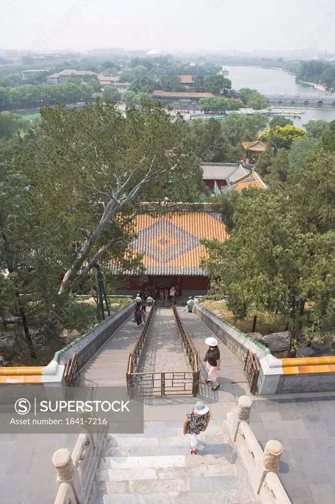 High angle view of tourists climbing stairs of pagoda, White Dagoba Temple, Beijing, China