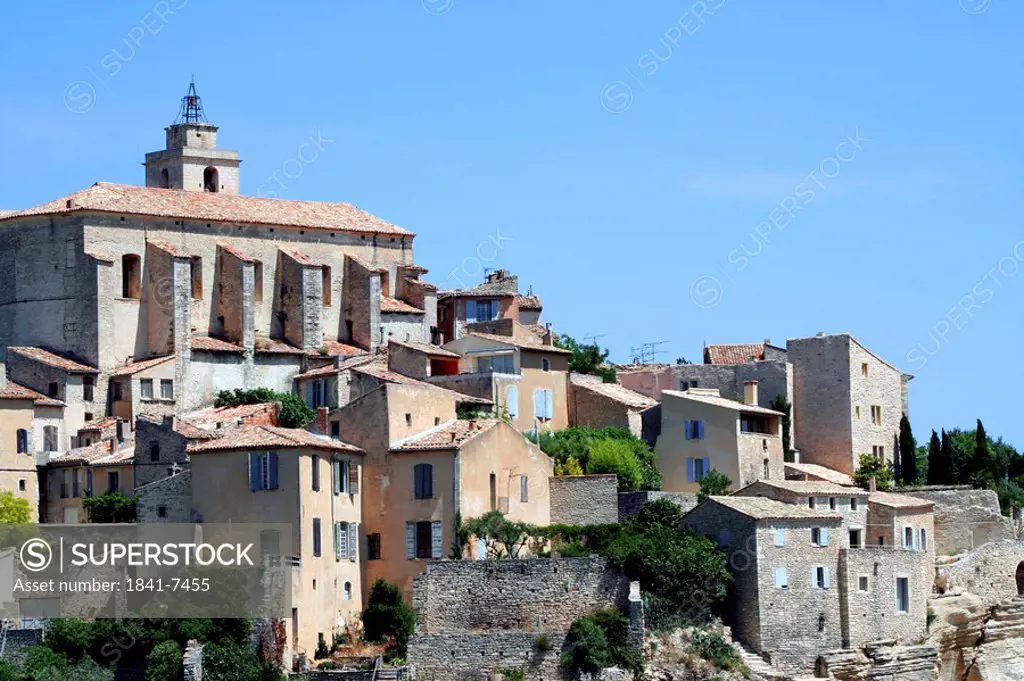 Stone houses and church in Gordes, France, low angle view