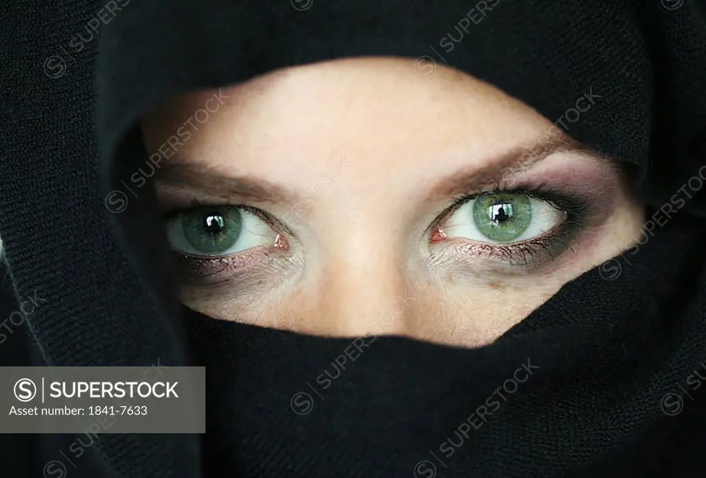Portrait of young woman wearing a burqa