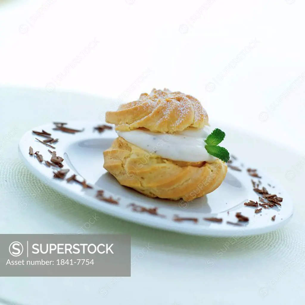 Close_up of cream puff on plate