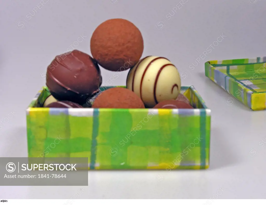 Close_up of open box of chocolate candies