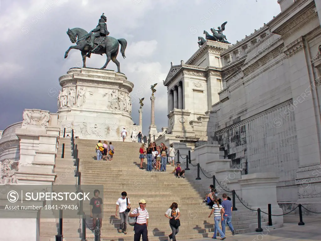 Tourists on staircase near equestrian statue
