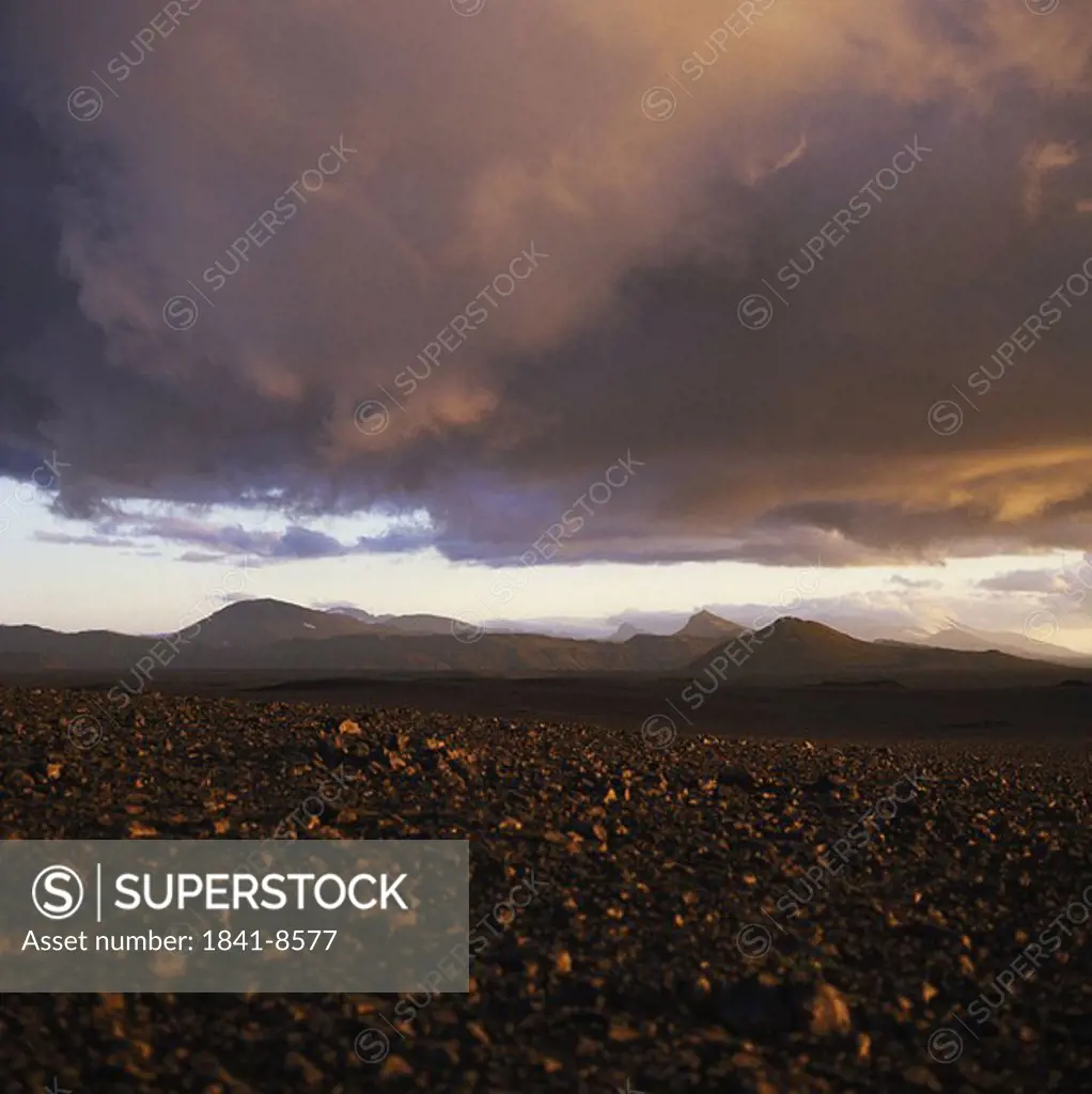 Purple dusky sky over arid landscape