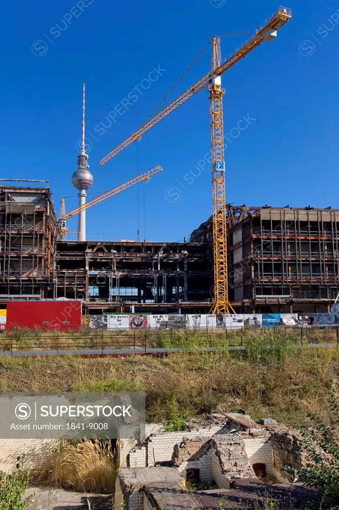 Cranes at construction site with television tower in background, Palast der Republik, Alexanderplatz, Berlin, Germany