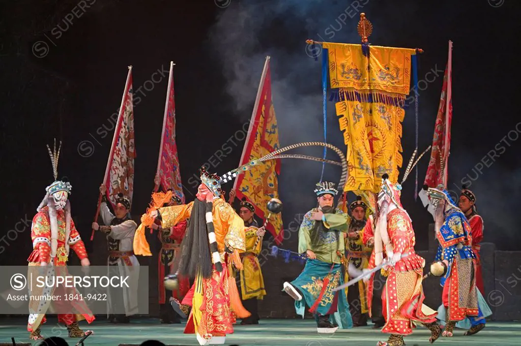 Group of stage performers performing in theater, Beijing, China