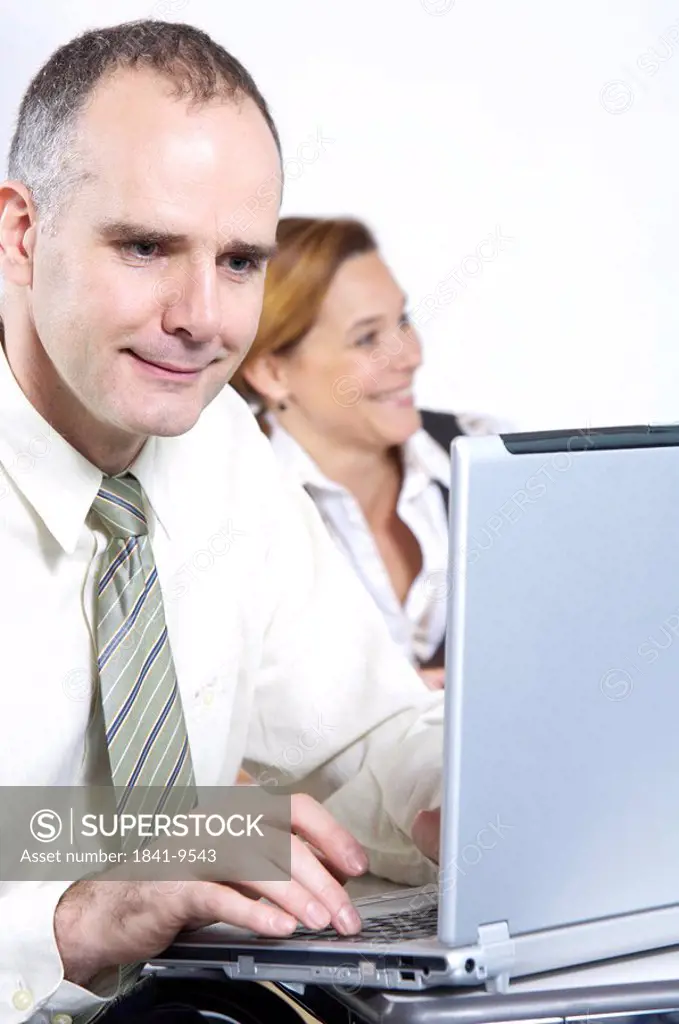 Close_up of businessman using laptop