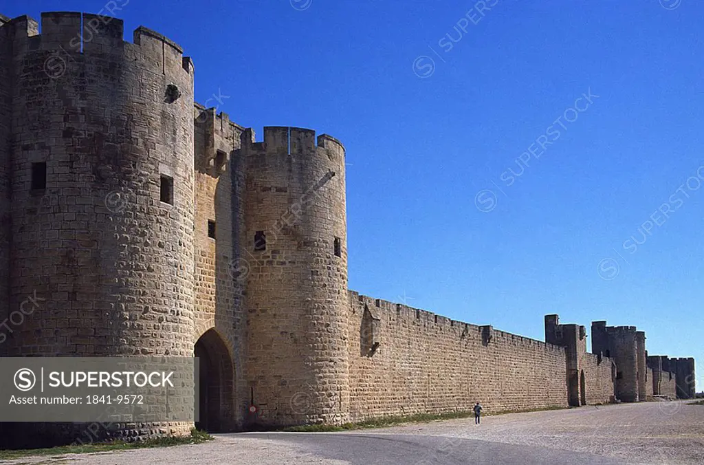 Fortified wall of castle against blue sky, Aigues_Mortes, Languedoc_Rousillon, France