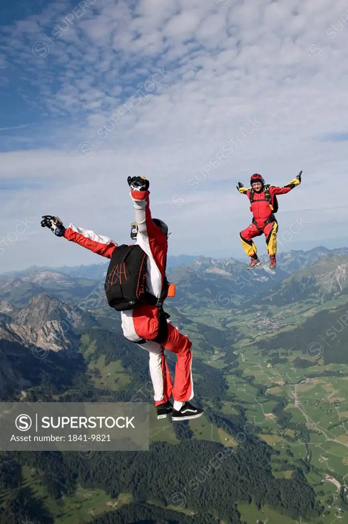 two people doing parachute jumping, full shot