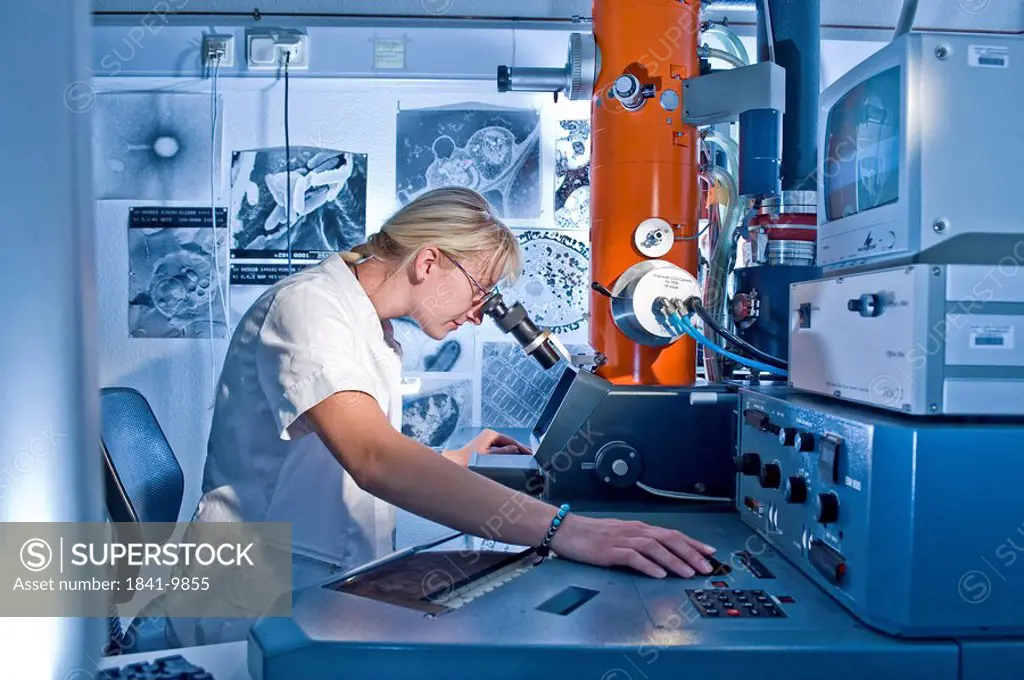 Laboratory technician working on an electron microscope, Max_Planck research,Fermentation protein folding, Halle, Germany, Europe