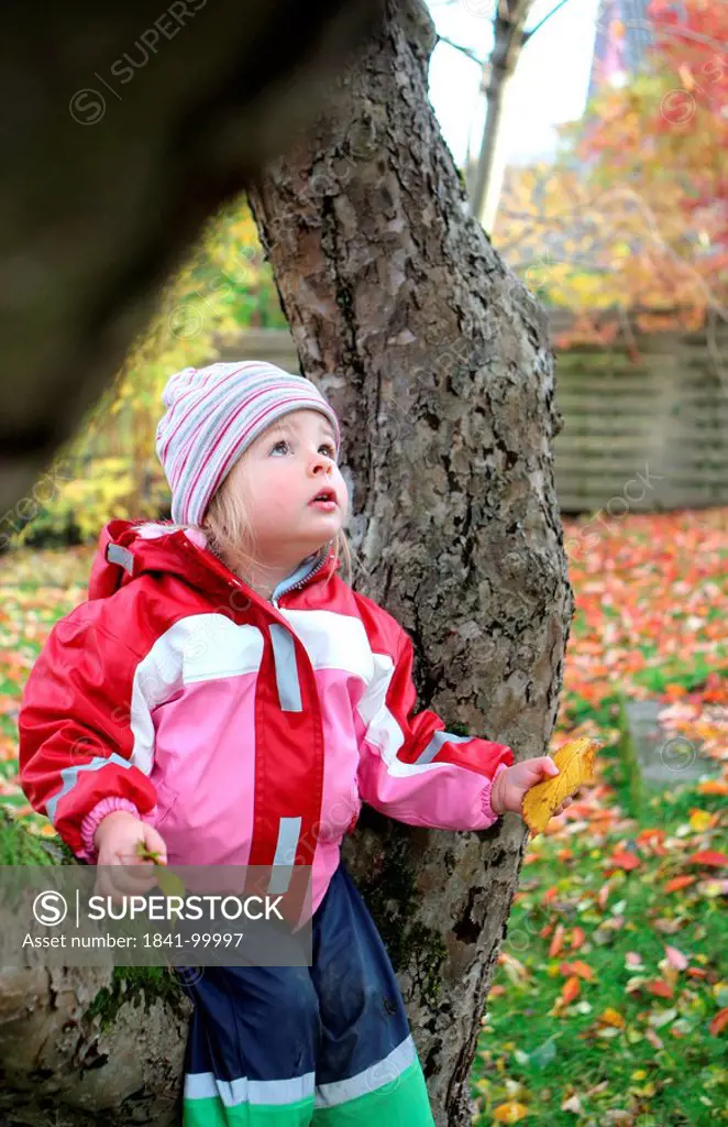 Girl in garden in autumn