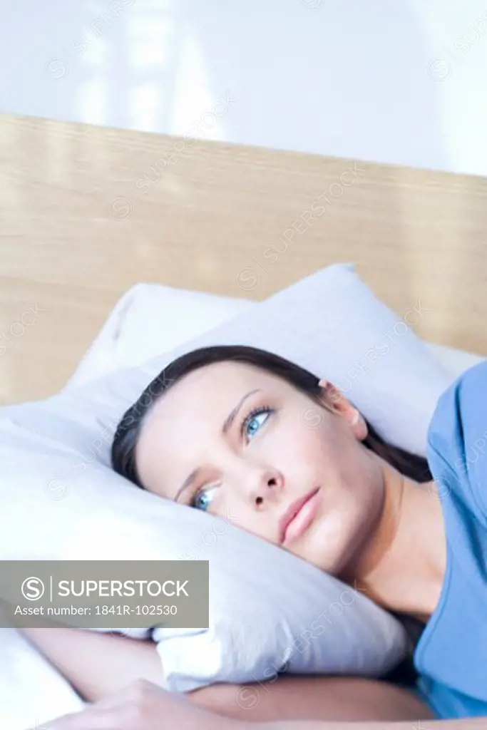 woman laying in bed