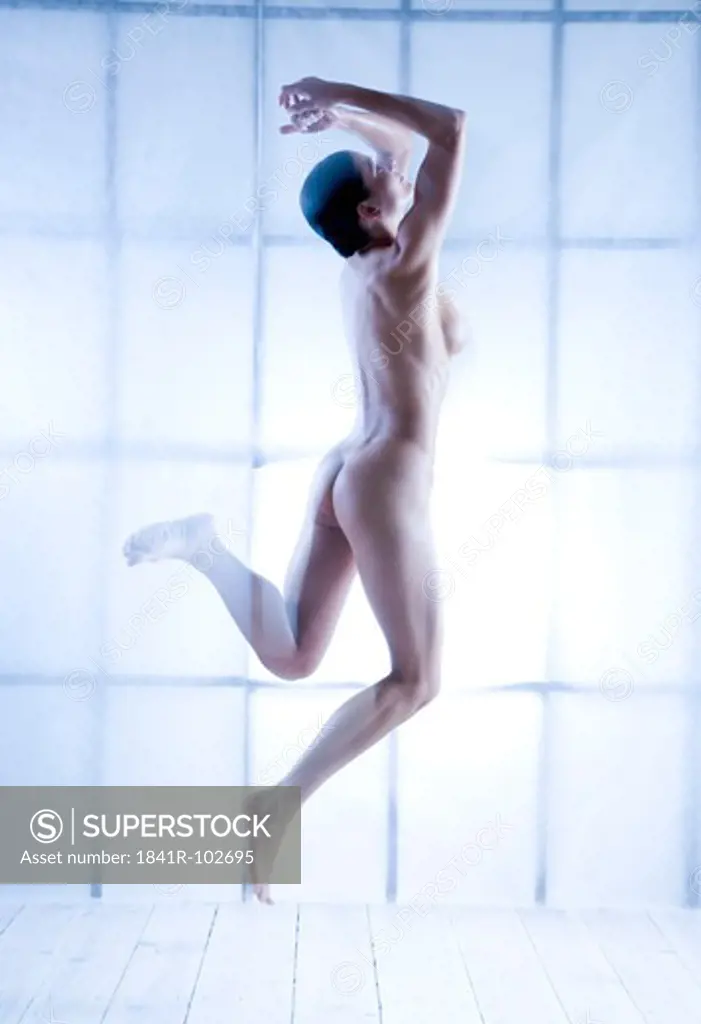 nude woman jumping