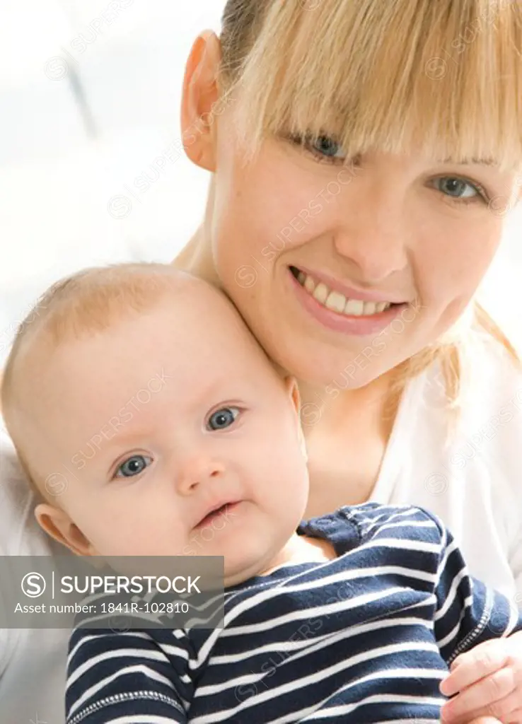 portrait of a mum with baby