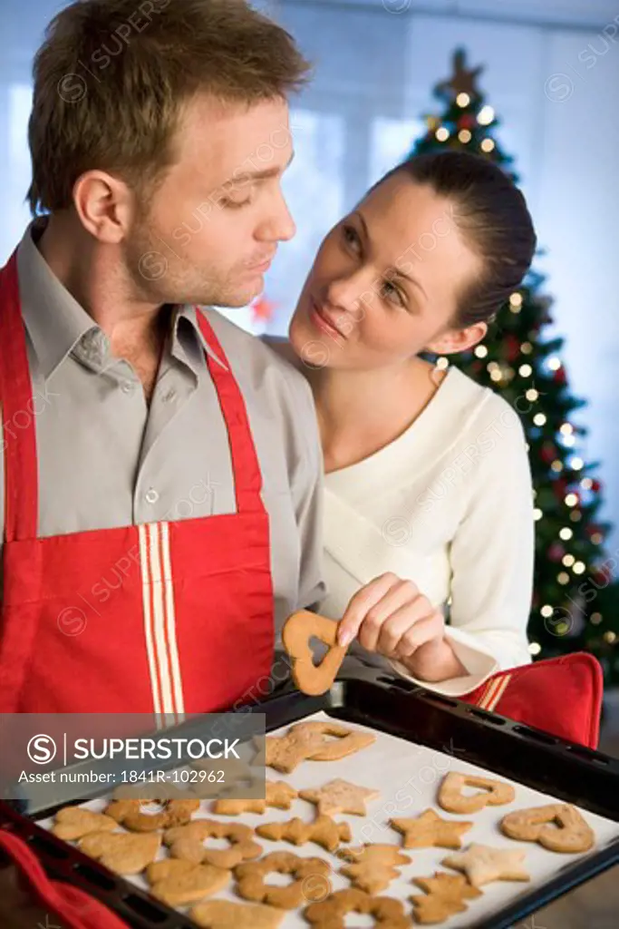 couple with christmas cookies
