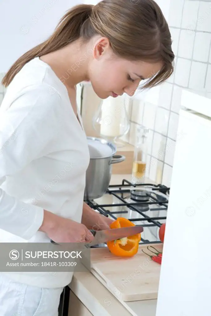woman cutting pepper