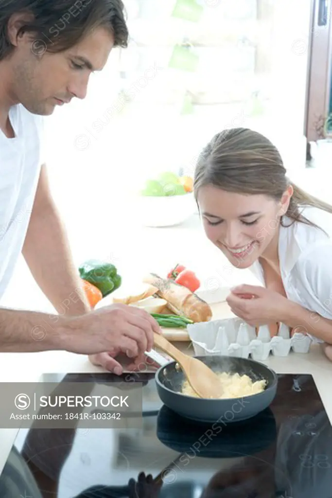 couple making scrambled egg