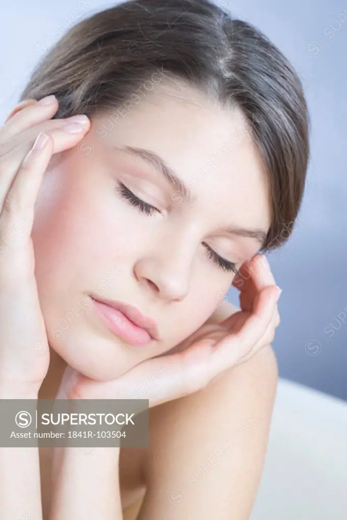 young woman massaging sinuses