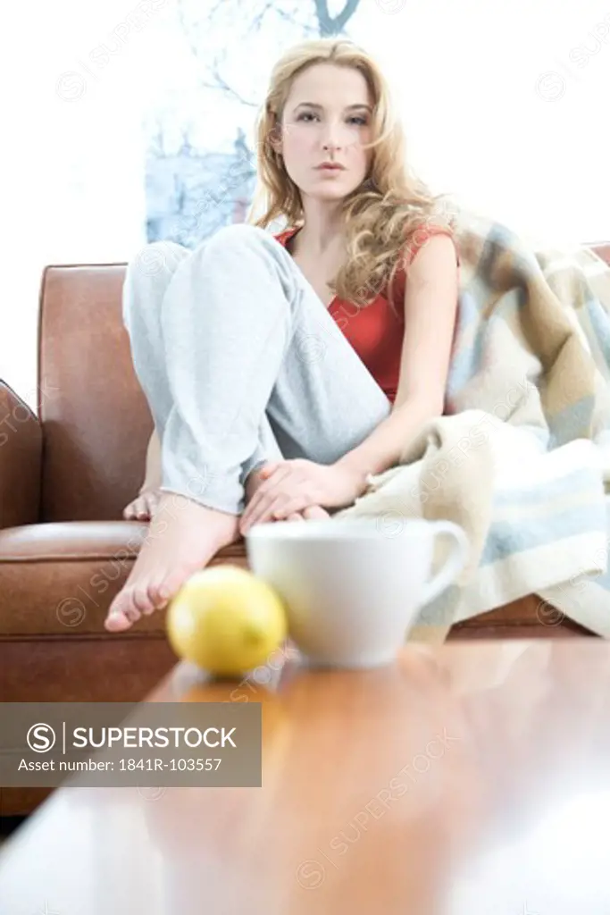 woman relaxing on sofa