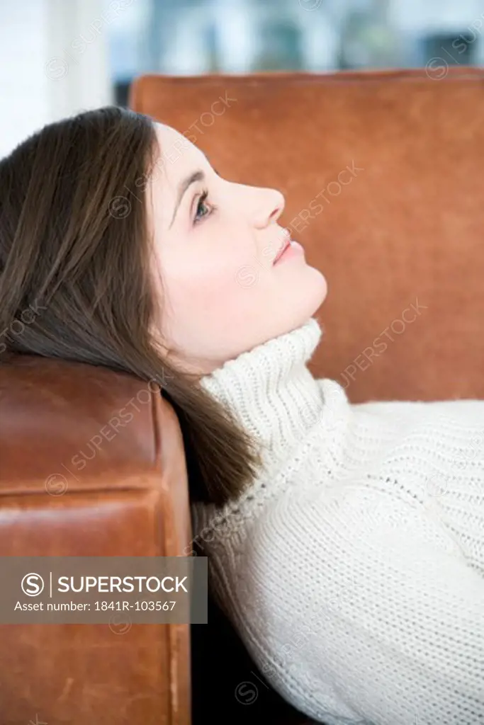 woman lying on sofa
