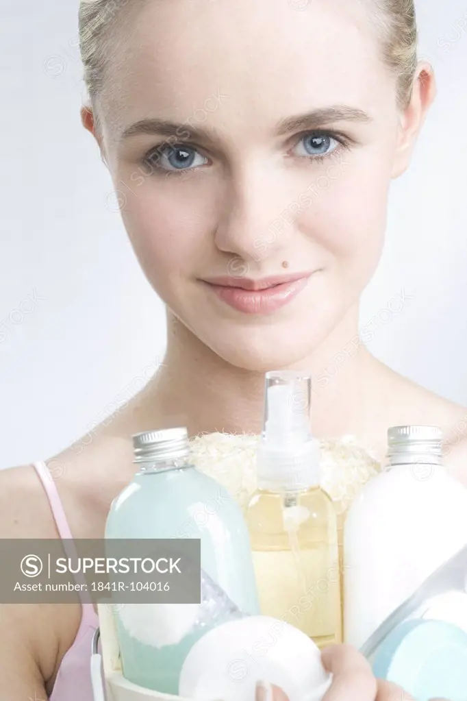 young woman with beauty care set