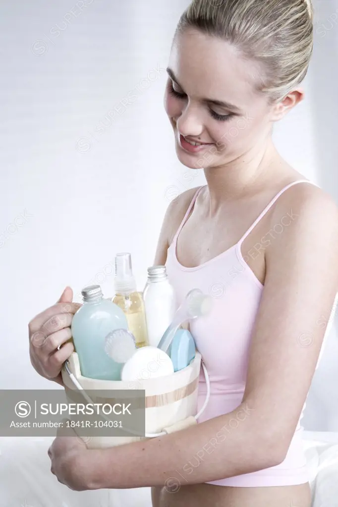 young woman with beauty care set