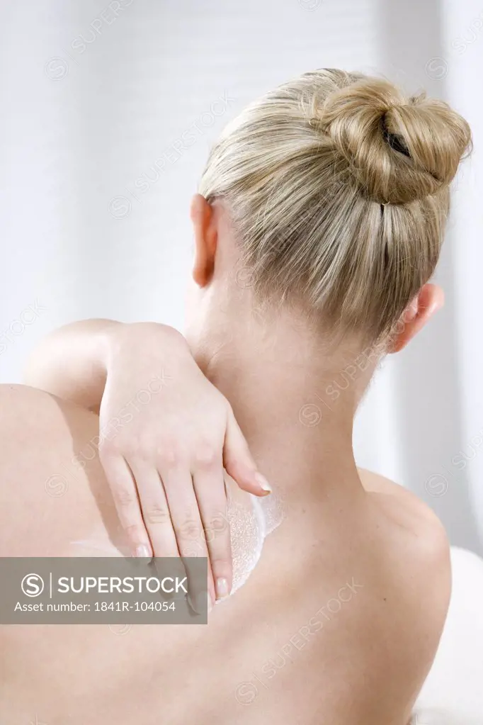 young woman creaming back