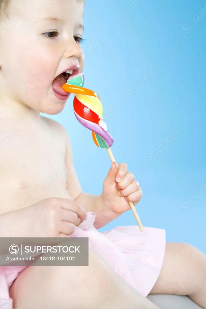 baby eating lollypop