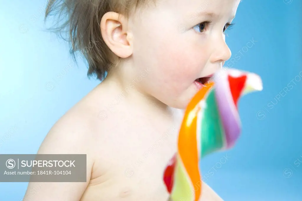 baby eating lollypop