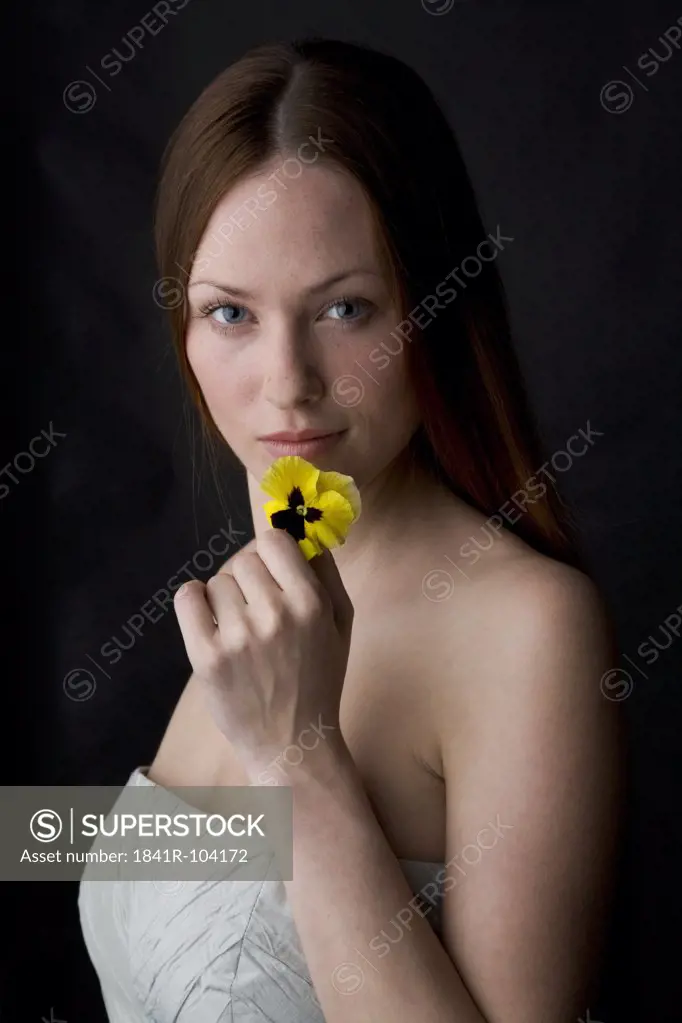 young wman smelling the flower