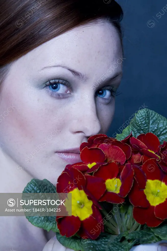 beauty woman with potted primula